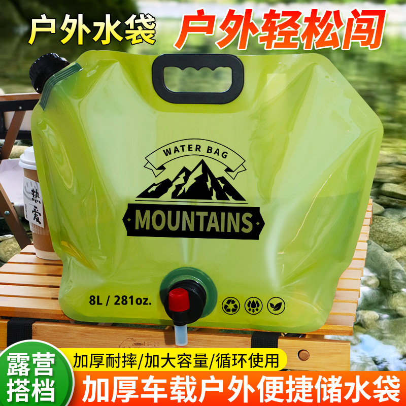 8L khaki collapsible camping water bag with rotary tap on outdoor picnic table
